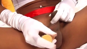 Tanned Ladyboy Nurse Teases With Her large milk shakes And long penis